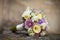 Elegant fresh rose wedding bouquet on a stone closeup