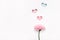 Elegant gerbera flower and colorful hearts holes. Minimal Creative Paper Art. Happy Mother`s Day, Women`s Day or Valentine`s Da