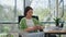 Elegant girl holding cup in creative office closeup. Lady enjoying cappuccino