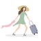 Elegant girl with a suitcase goes on a journey, towards adventure. she runs to the airport or train station, in a hurry.  She wear