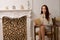 Elegant glamorous young woman in her living room