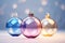 Elegant glass ornaments in hues of blue pink and gold glisten against a soft bokeh background