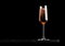 Elegant glass of pink rose champagne with bubbles on blavk marble board on black background. Space for text