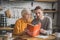 Elegant good-looking grey-haired woman and her son looking involved