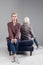 Elegant good-looking woman in oversize jacket sitting facing forward