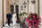 Elegant gorgeous bride and stylish groom walking holding hands,