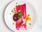 Elegant Gourmet Fine Dine Carrot, Radish, Mushroom with a Brushed Beetroot Reduction and Garnished with Nasturtium Flower and Peta