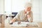 Elegant Grandmother Reading at Home