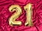 Elegant greeting card. Anniversary, number 21 foil gold balloon. Happy birthday, congratulations poster on red silk