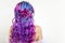 Elegant hairstyle of curls on long colored hair, styling. Bright color coloring, concept.