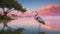 The elegant heron at the heart of a pristine, rippling aquamarine lake