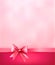 Elegant holiday background with gift pink bow