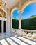 an elegant house entry way with pillars and a chandelier