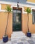 Elegant house green door and yucca plants, Athens Greece