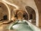 An elegant indoor swimming pool. A minimalistic beige stylish interior of hamam