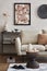 Elegant interior of living room with beige sofa, black console, mock up poster frame and stylish home decor. Copy space.