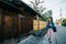 Elegant lady pointing at Japanese building