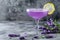 Elegant Lavender Cocktail in Crystal Glass with Floral Accents