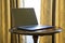 Elegant lightweight laptop on vintage wooden table with blank screen