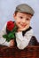 Elegant little boy with rosa