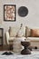 Elegant living room interior composition with beige sofa, black console, coffee table, pouf, mock up poster frame.