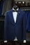 Elegant male mannequin presenting luxury suits tuxedo and male fashion accesories