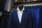 Elegant male mannequin presenting luxury suits tuxedo and male fashion accesories