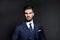 Elegant man with blue classic dress in studio pose