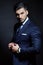 Elegant man with blue classic dress in studio pose