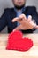 Elegant man in suit with red heart on Valentine`s Day