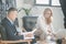 Elegant man and woman working together in the office