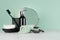 Elegant men dressing table in trend green mint menthe color - black razor, toothbrush, mirror, soap, towel, dispenser.