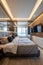 Elegant modern bedroom with a plush bed and stylish mirrored wall design