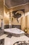 Elegant mosaic bathroom with large bathtub