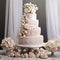 Elegant Multi-tiered Wedding Cake with Intricate Details and Luxurious Embellishments