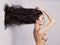 Elegant naked lady with long healthy hair