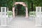 Elegant Outdoor Altar: Wedding Arch Adorned with Beautiful Roses and Fresh Flowers