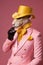 Elegant panter wearing colorful clothes on a pink background. Generative AI