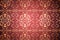 Elegant patterned wallpaper in red and gold