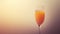 Elegant Peach Bellini in Tall Glassware with Soft Gradient Background