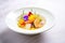 elegant plating of prawn curry with edible flowers