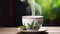 Elegant porcelain cup with steaming green tea and green leaves on wooden table against blurred background.