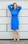 Elegant professional woman in blue outfit and high heels