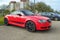 Elegant red Audi TT Quattro car with two doors parked