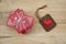 Elegant red gift box stack decorated with mini heart figure on wood background, valentine love present concept