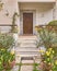 Elegant residence entrance wooden door and stairs