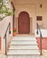 Elegant residence entrance wooden door and stairs