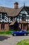 Elegant retro Car in front of old tudor house. Classic cars festival `Brums and Buns` at Chester, UK