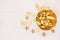 Elegant rich gold christmas home decoration on white wood background, top view.