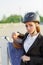 Elegant rider woman in helmet with whip